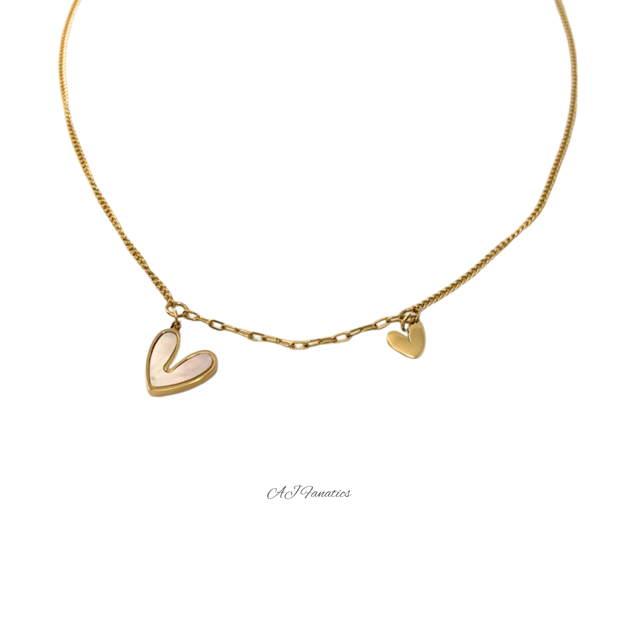 Gold-tone stainless steel necklace with a larger heart-shaped shell pendant and a smaller gold heart charm on a fine chain, shown against a white background.